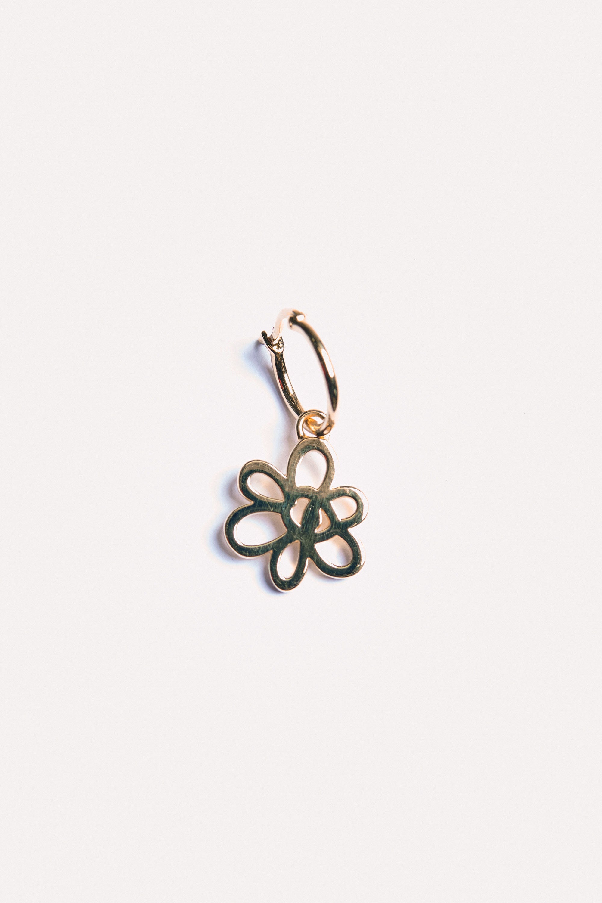 The OUTLINE GESTURE EARRING - GOLD available online with global shipping, and in PAM Stores Melbourne and Sydney.