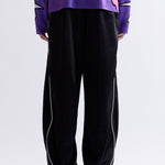 The MIRAGE TRACK PANT - BLACK available online with global shipping, and in PAM Stores Melbourne and Sydney.