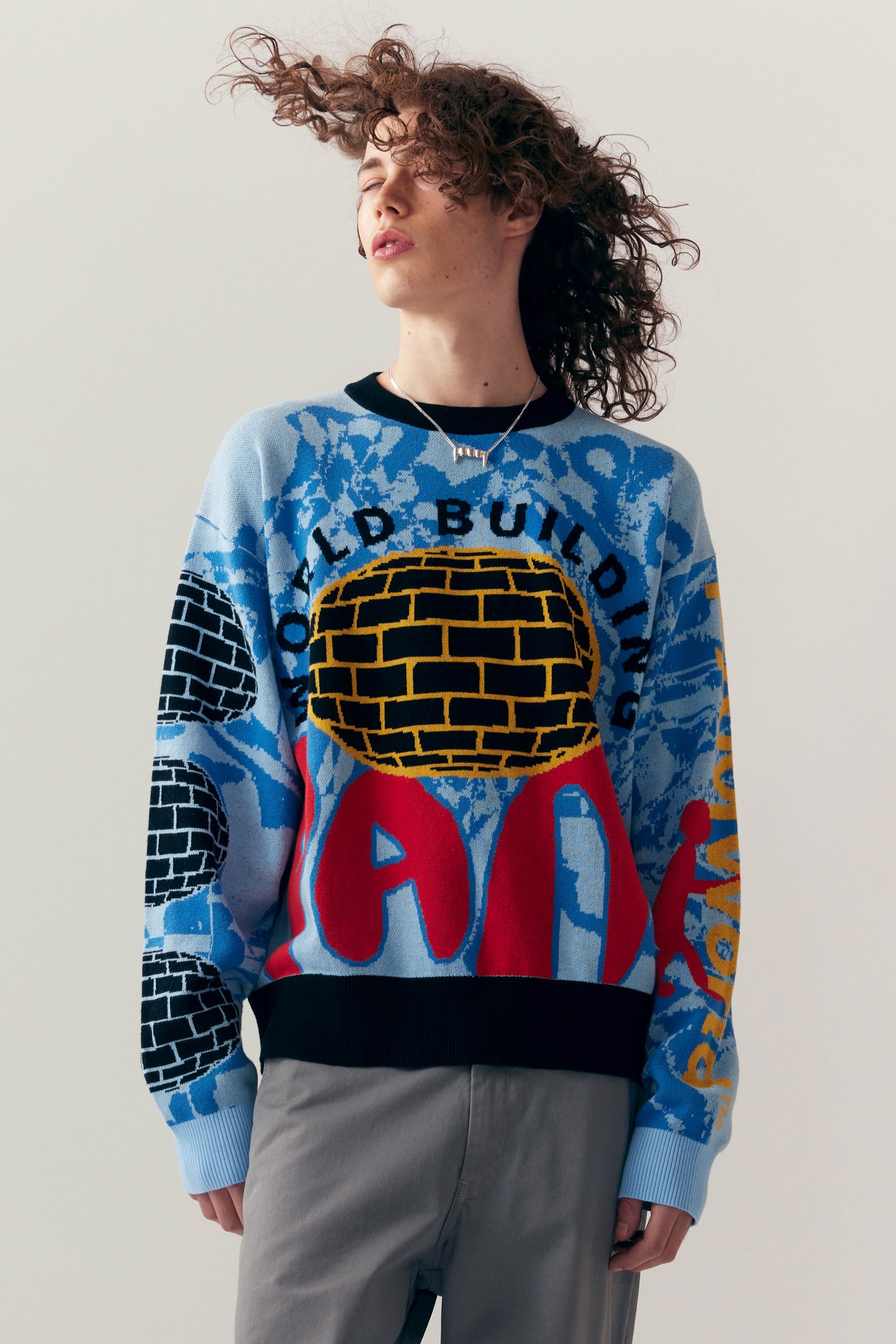 The WORLD BUILDING GRAPHIC JACQUARD KNIT  available online with global shipping, and in PAM Stores Melbourne and Sydney.