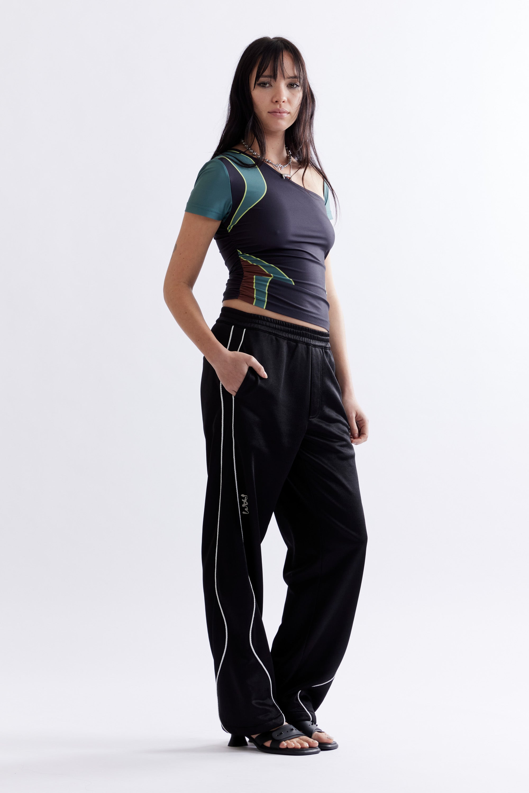 The MIRAGE TRACK PANT - BLACK available online with global shipping, and in PAM Stores Melbourne and Sydney.