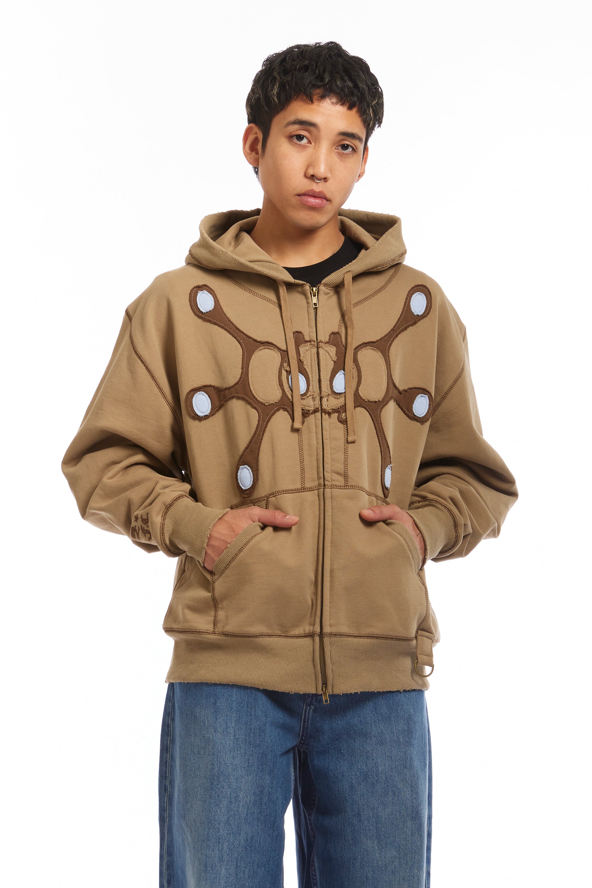 The Angel99 Zip Hoodie Beige available online with global shipping, and in PAM Stores Melbourne and Sydney.
