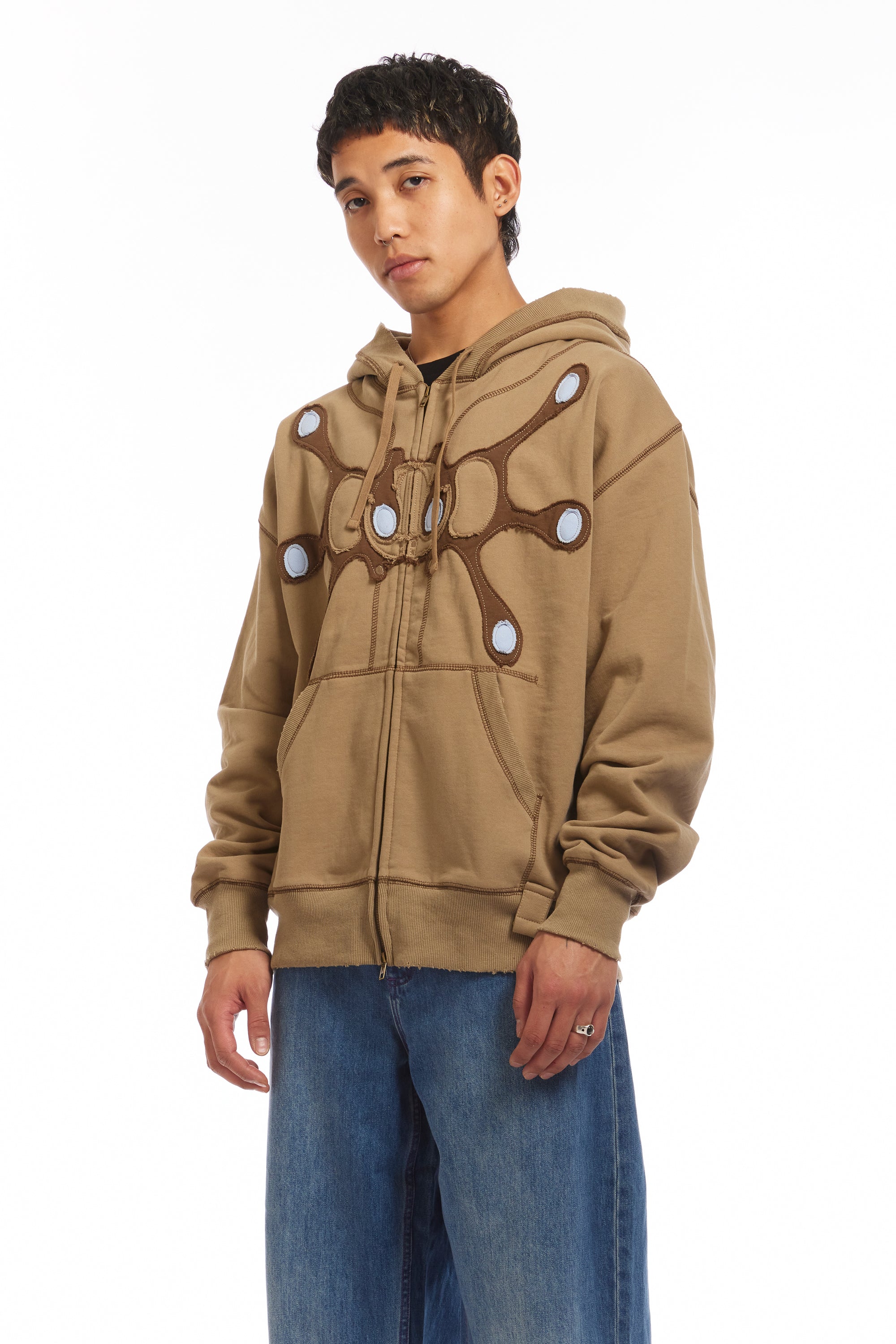 The Angel99 Zip Hoodie Beige available online with global shipping, and in PAM Stores Melbourne and Sydney.