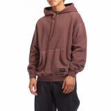The PIGMENT DYED SWEAT HOODIE BURGUNDY available online with global shipping, and in PAM Stores Melbourne and Sydney.
