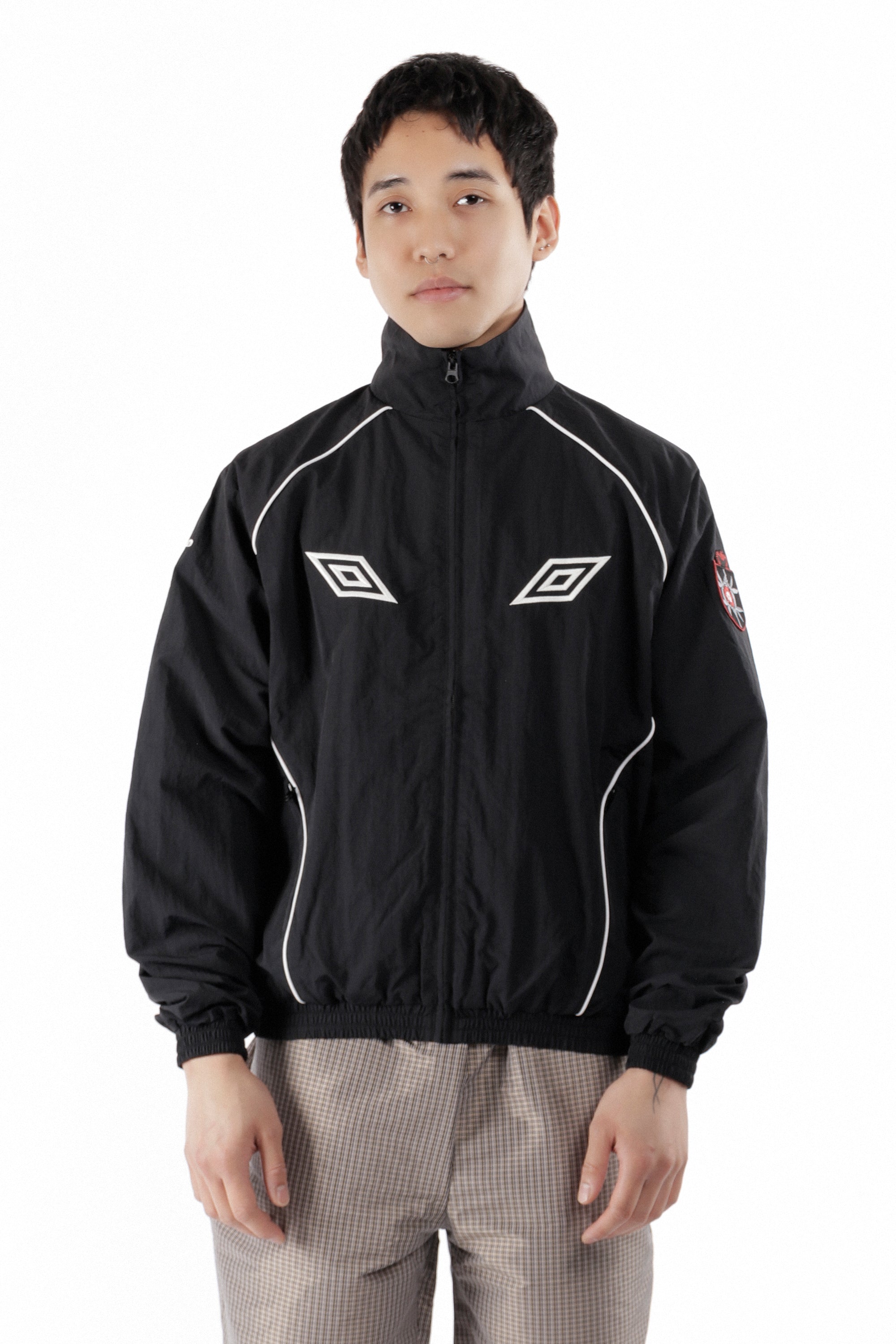 The Eyes Tracksuit Jacket Black available online with global shipping, and in PAM Stores Melbourne and Sydney.