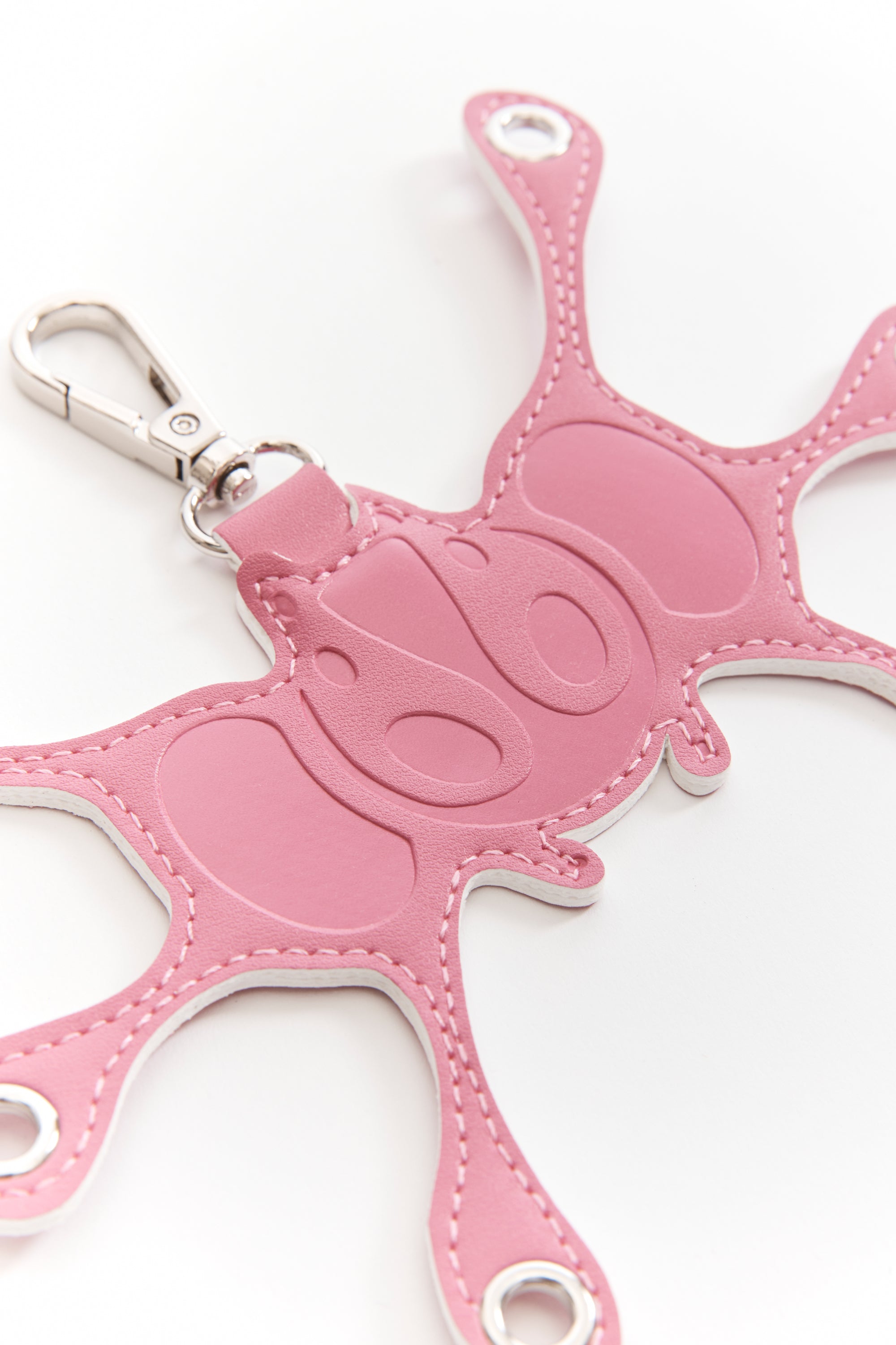 The Angel99 Grommet Keychain Pink available online with global shipping, and in PAM Stores Melbourne and Sydney.
