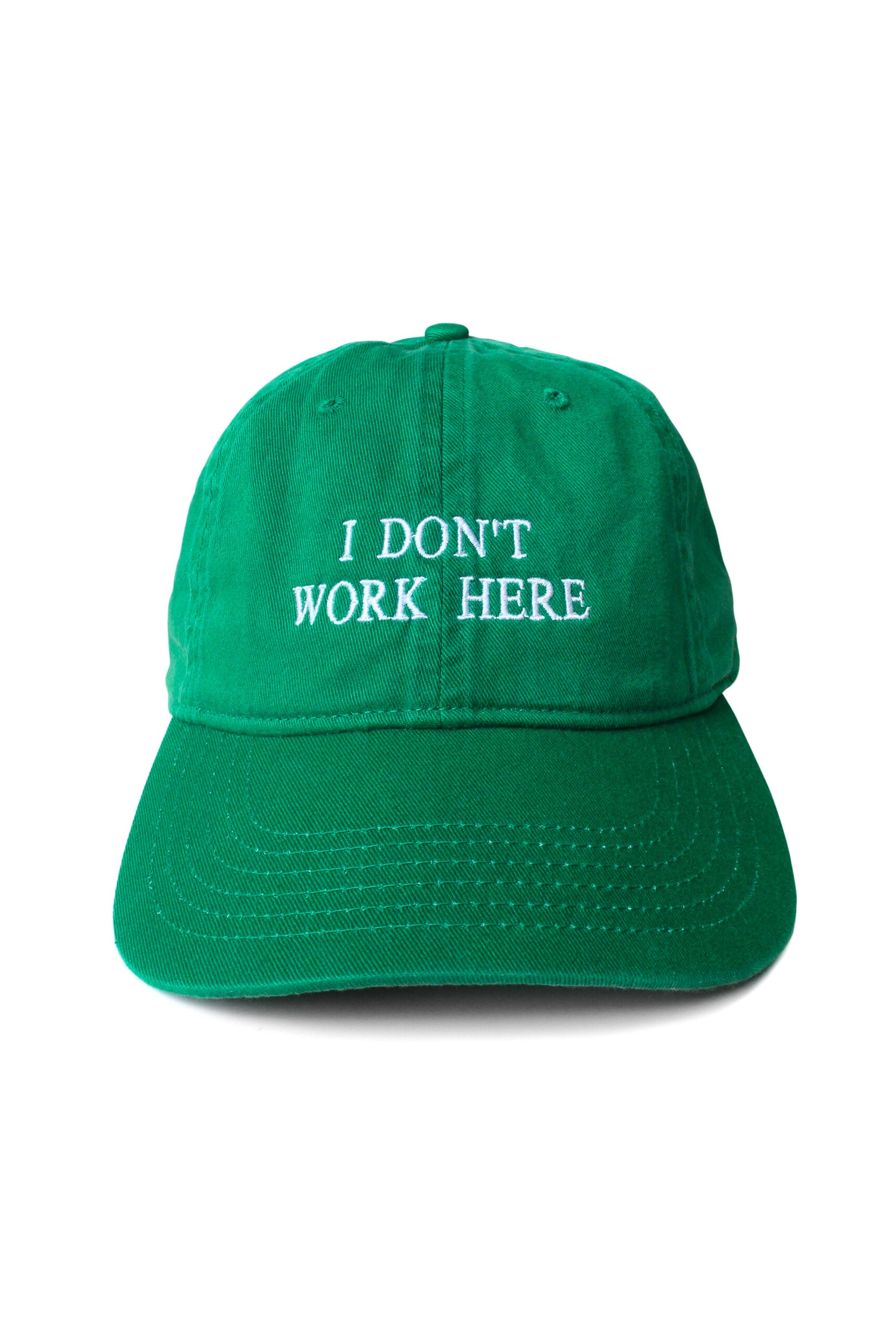 The SORRY I DON'T WORK HERE CAP GREEN available online with global shipping, and in PAM Stores Melbourne and Sydney.