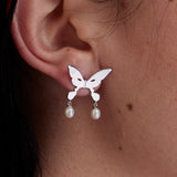 The PEARL DROP ALIEN KISS EARRING available online with global shipping, and in PAM Stores Melbourne and Sydney.