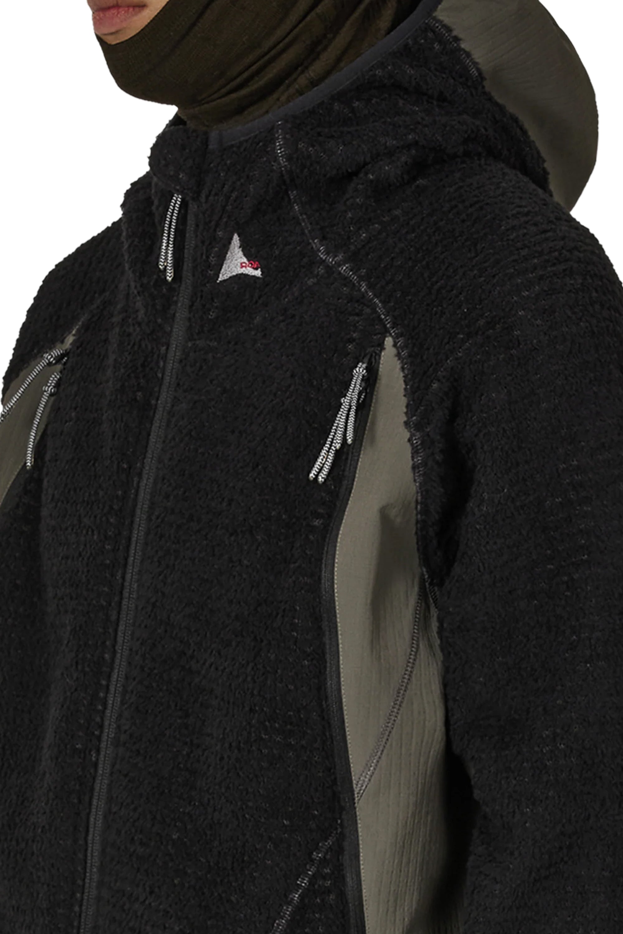 The Kai Polartech High Loft Jacket Black Dark Olive available online with global shipping, and in PAM Stores Melbourne and Sydney.