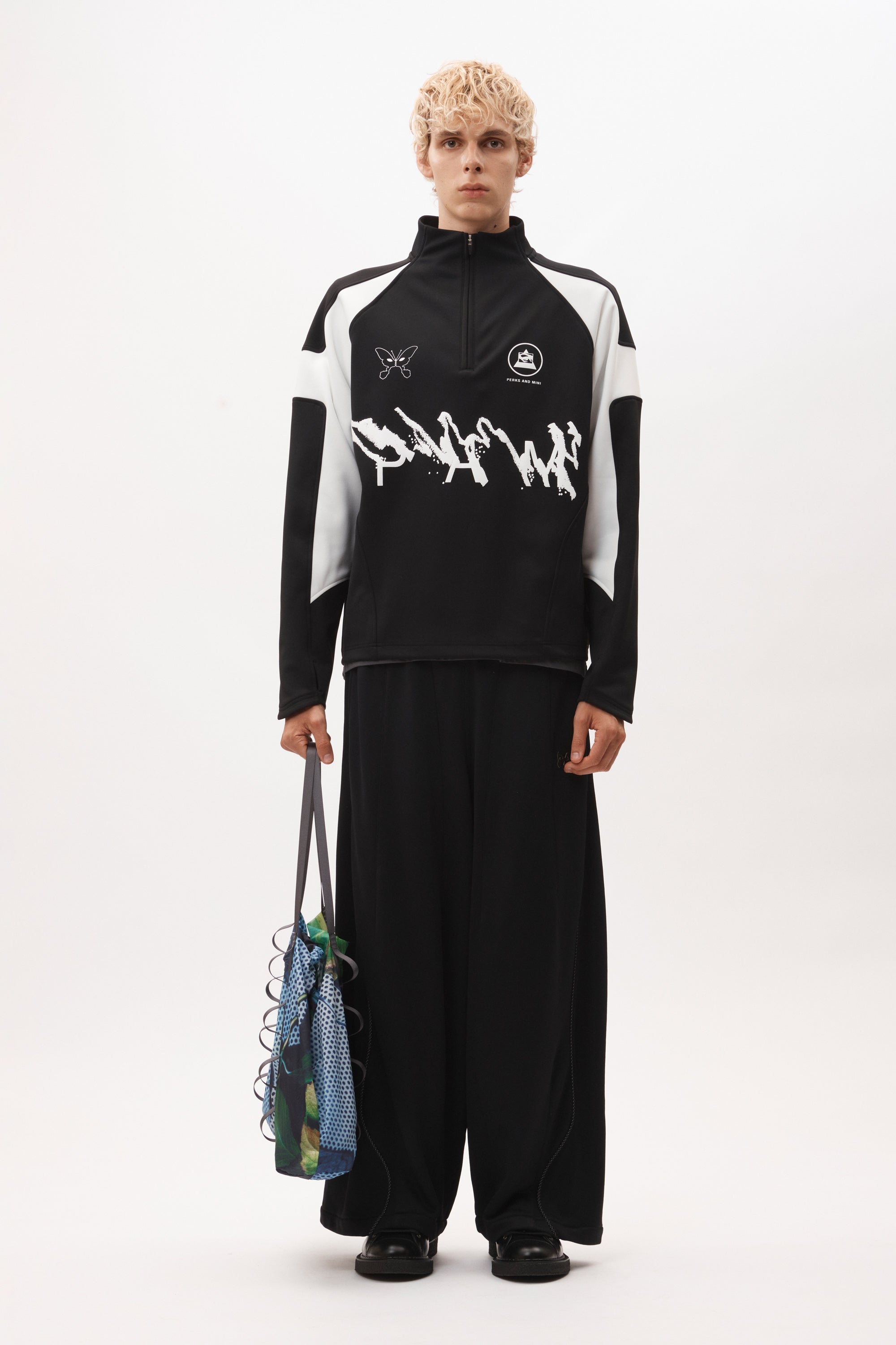 The ANGEL PULLOVER - BLACK WHITE available online with global shipping, and in PAM Stores Melbourne and Sydney.