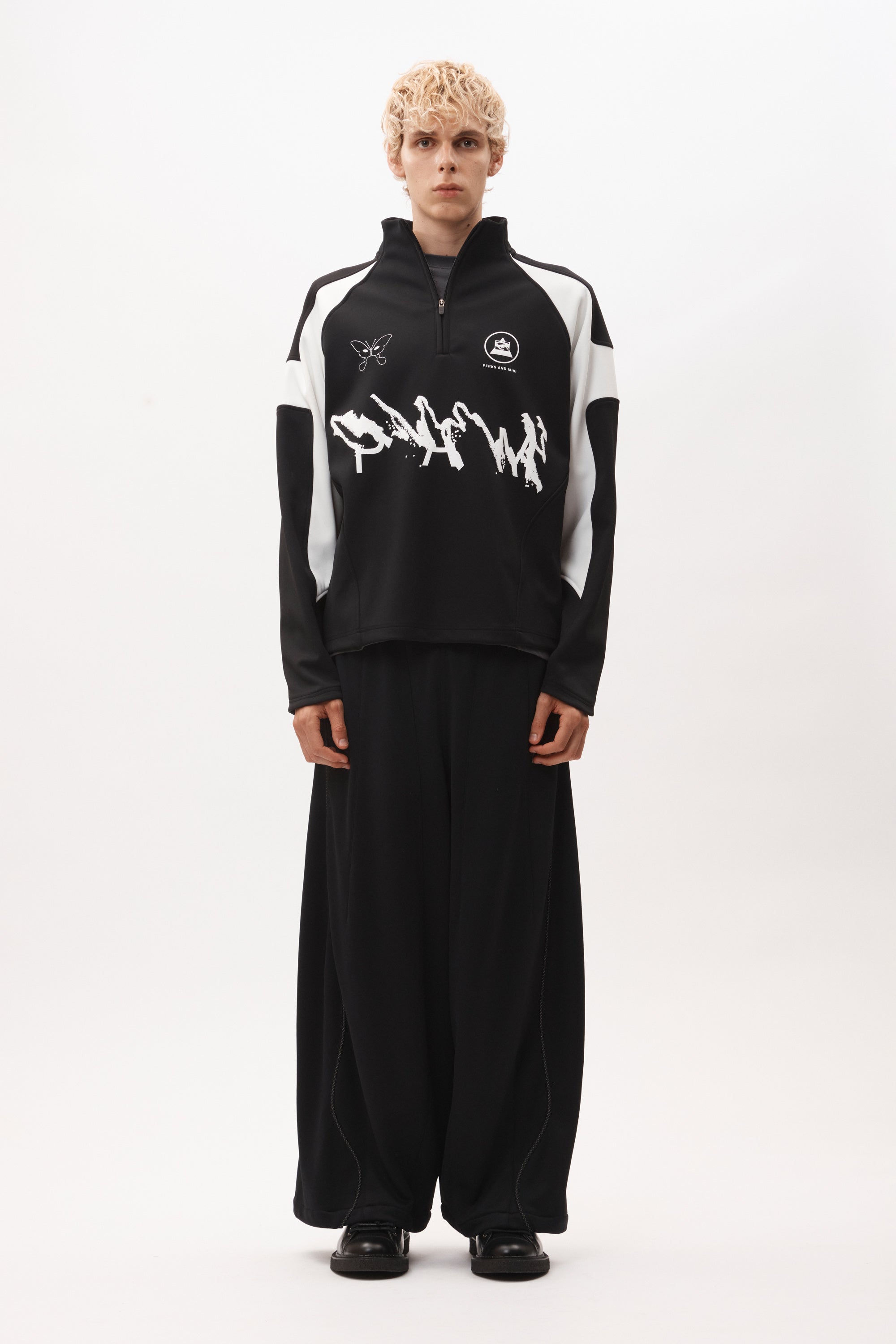 The ANGEL PULLOVER - BLACK WHITE available online with global shipping, and in PAM Stores Melbourne and Sydney.