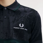 The Perks And Mini X Fred Perry Polo Shirt available online with global shipping, and in PAM Stores Melbourne and Sydney.