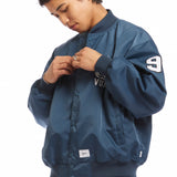The NYLON TWILL TEAM JACKET TEAL available online with global shipping, and in PAM Stores Melbourne and Sydney.