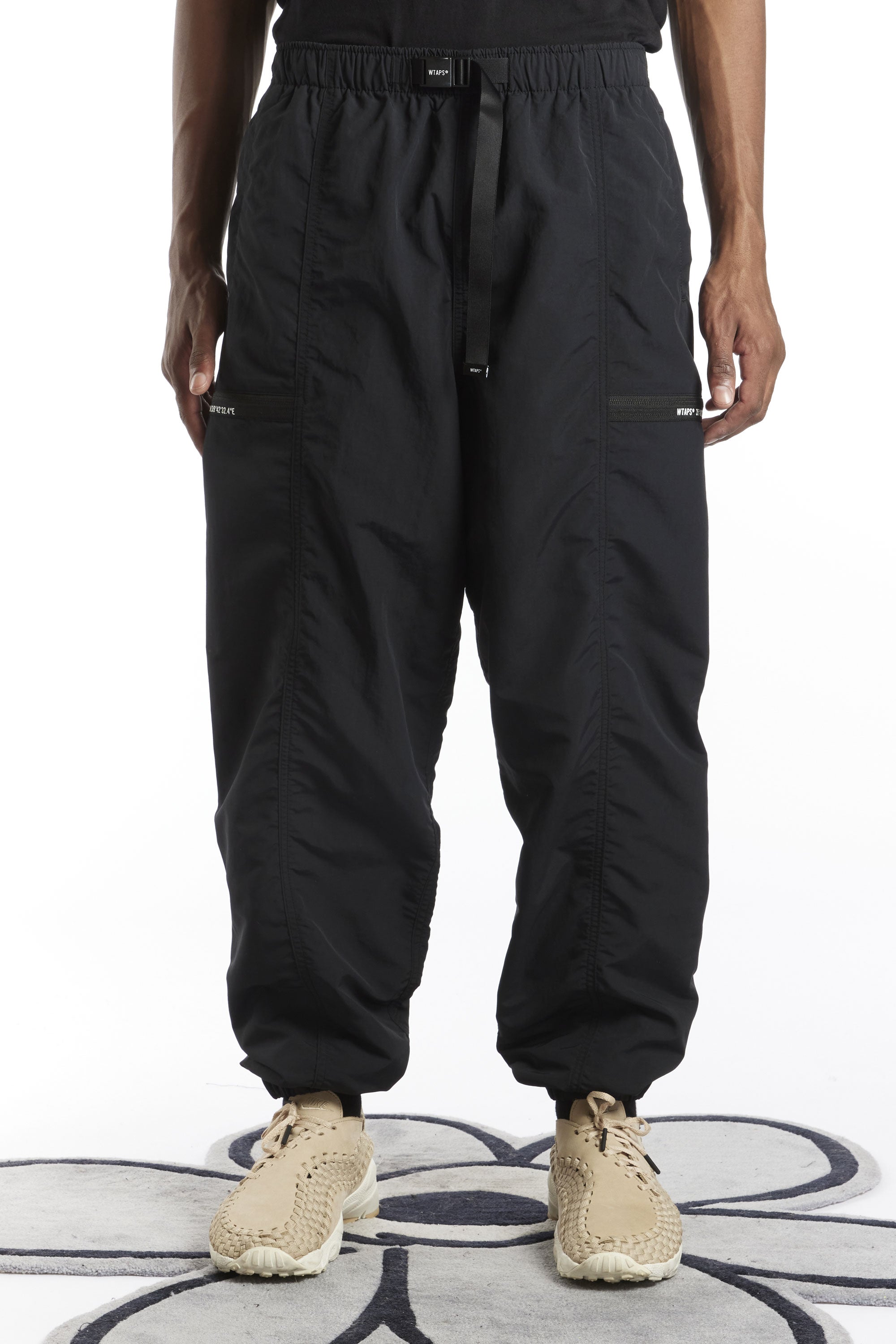 The WTAPS - SPST2003 NYLON WEATHER TRACKS  TROUSERS BLACK available online with global shipping, and in PAM Stores Melbourne and Sydney.
