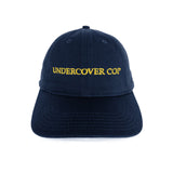 The UNDERCOVER COP CAP available online with global shipping, and in PAM Stores Melbourne and Sydney.