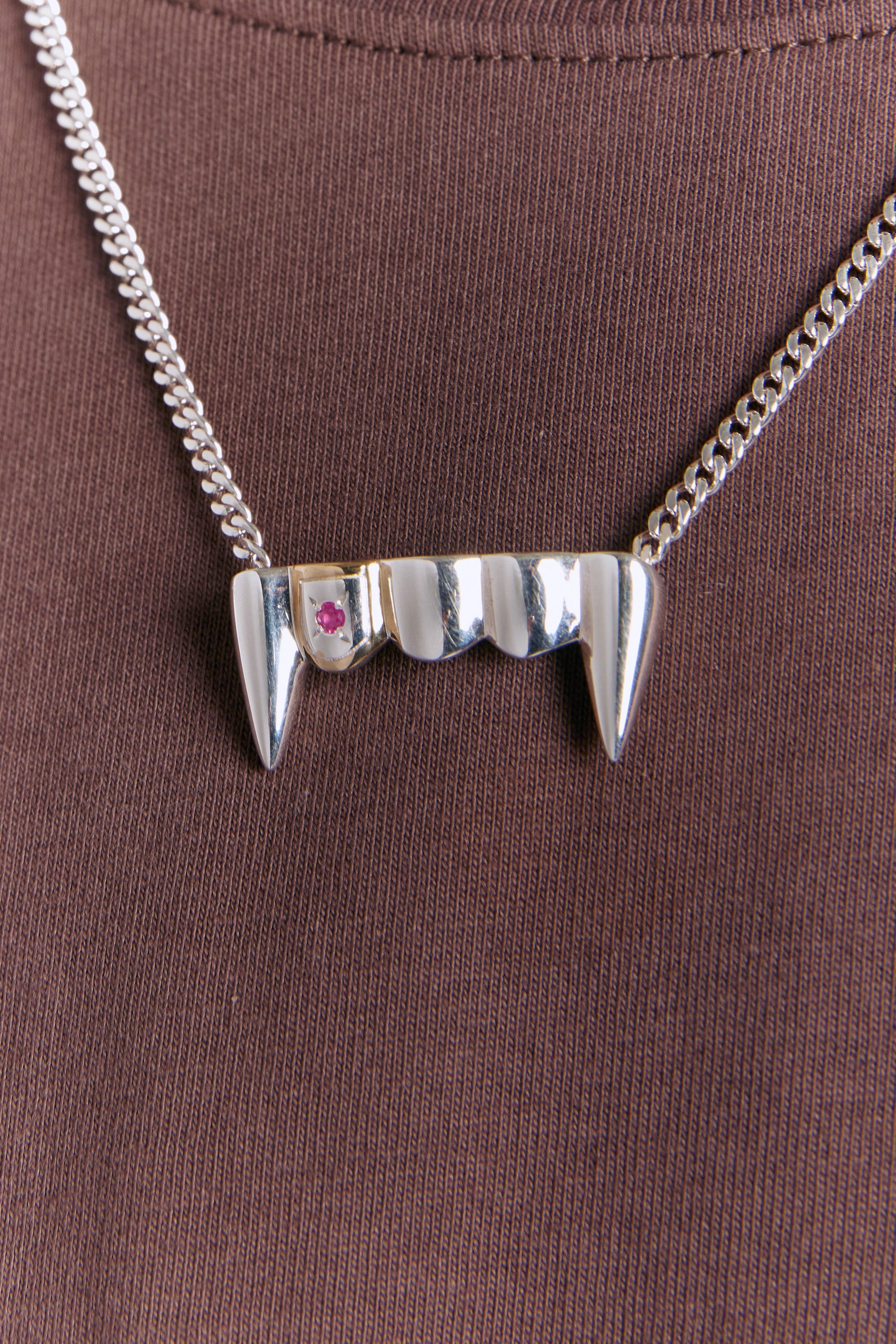 The SINGLE RUBY FANGZ NECKLACE  available online with global shipping, and in PAM Stores Melbourne and Sydney.