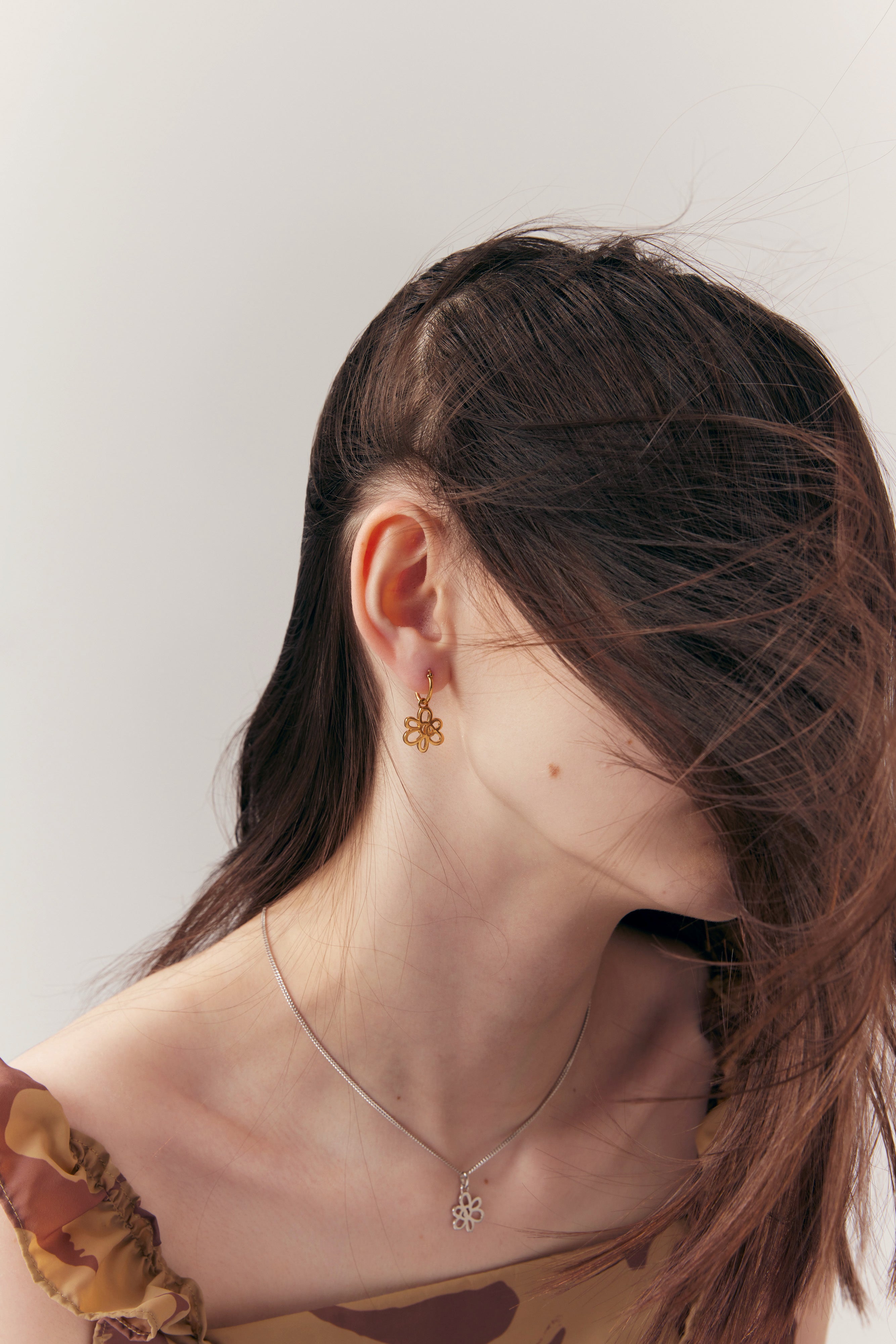 The GATEWAY FRAME GOLD GESTURE EARRING  available online with global shipping, and in PAM Stores Melbourne and Sydney.