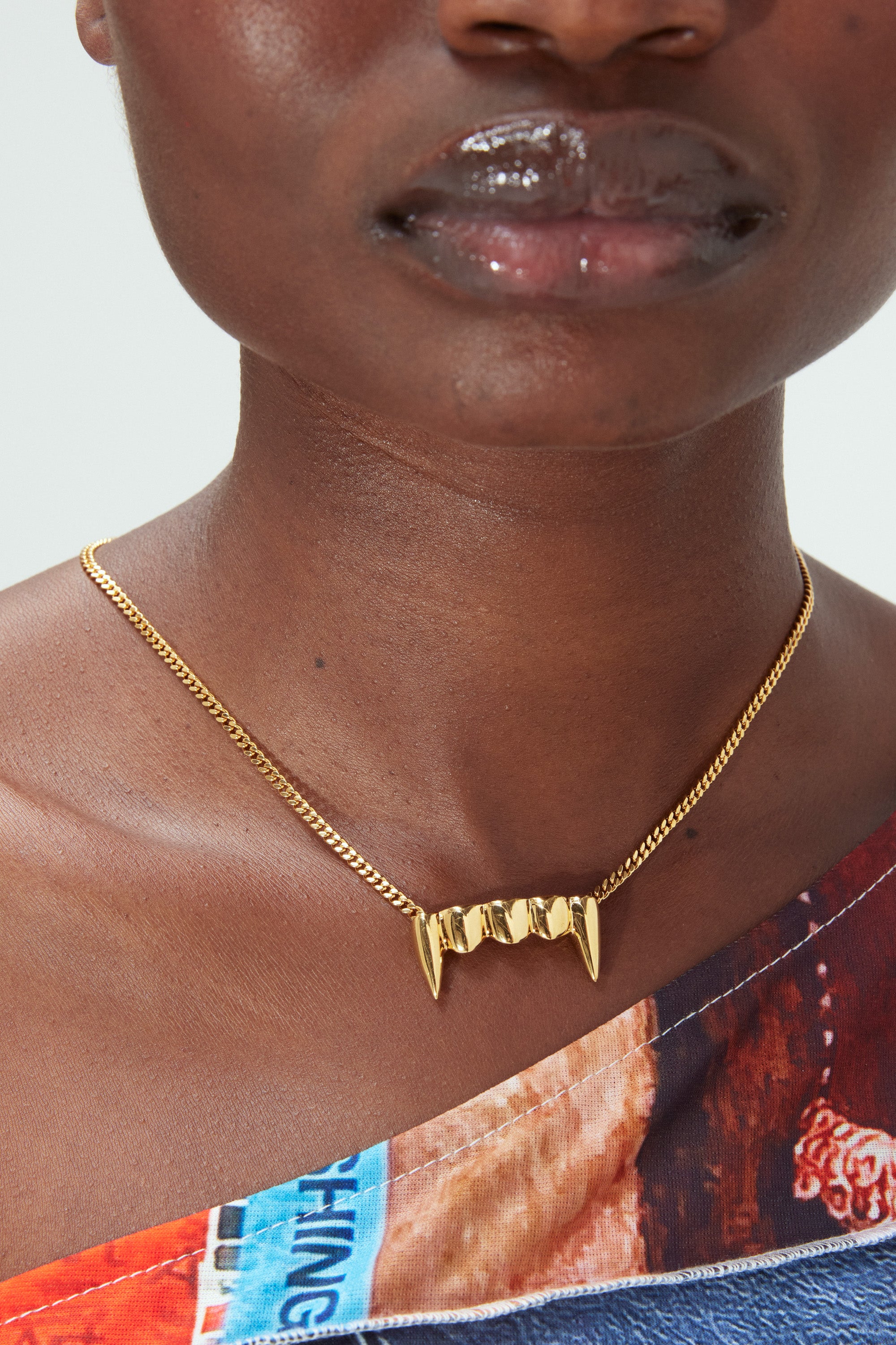 The FANGZ NECKLACE WTTC GOLD  available online with global shipping, and in PAM Stores Melbourne and Sydney.