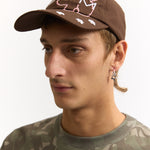 The BRICK GESTURES BASEBALL CAP available online with global shipping, and in PAM Stores Melbourne and Sydney.