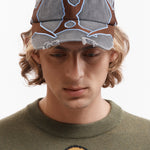 The OUTLINE LOGO CAP available online with global shipping, and in PAM Stores Melbourne and Sydney.