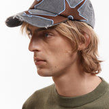The OUTLINE LOGO CAP available online with global shipping, and in PAM Stores Melbourne and Sydney.