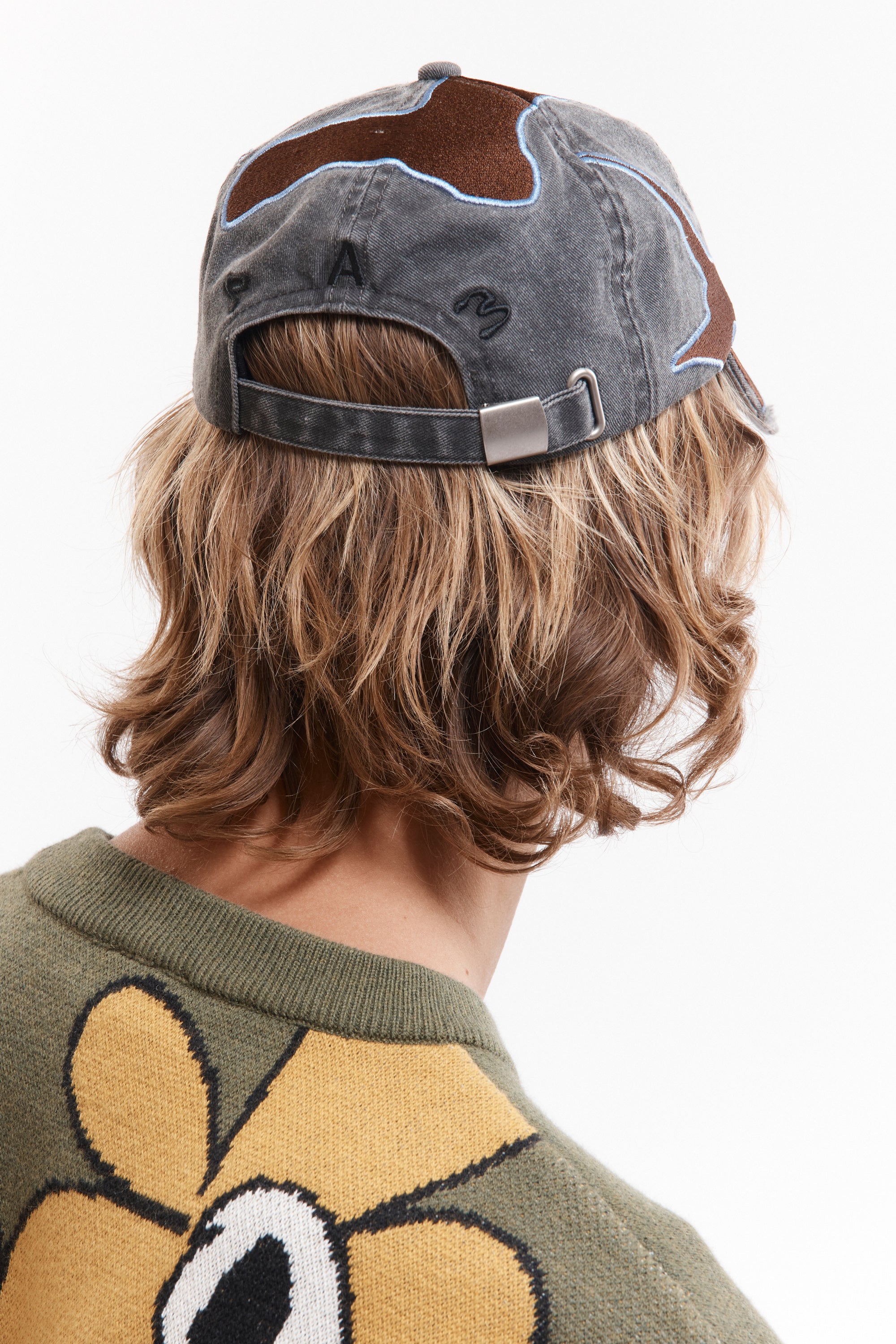 The OUTLINE LOGO CAP available online with global shipping, and in PAM Stores Melbourne and Sydney.