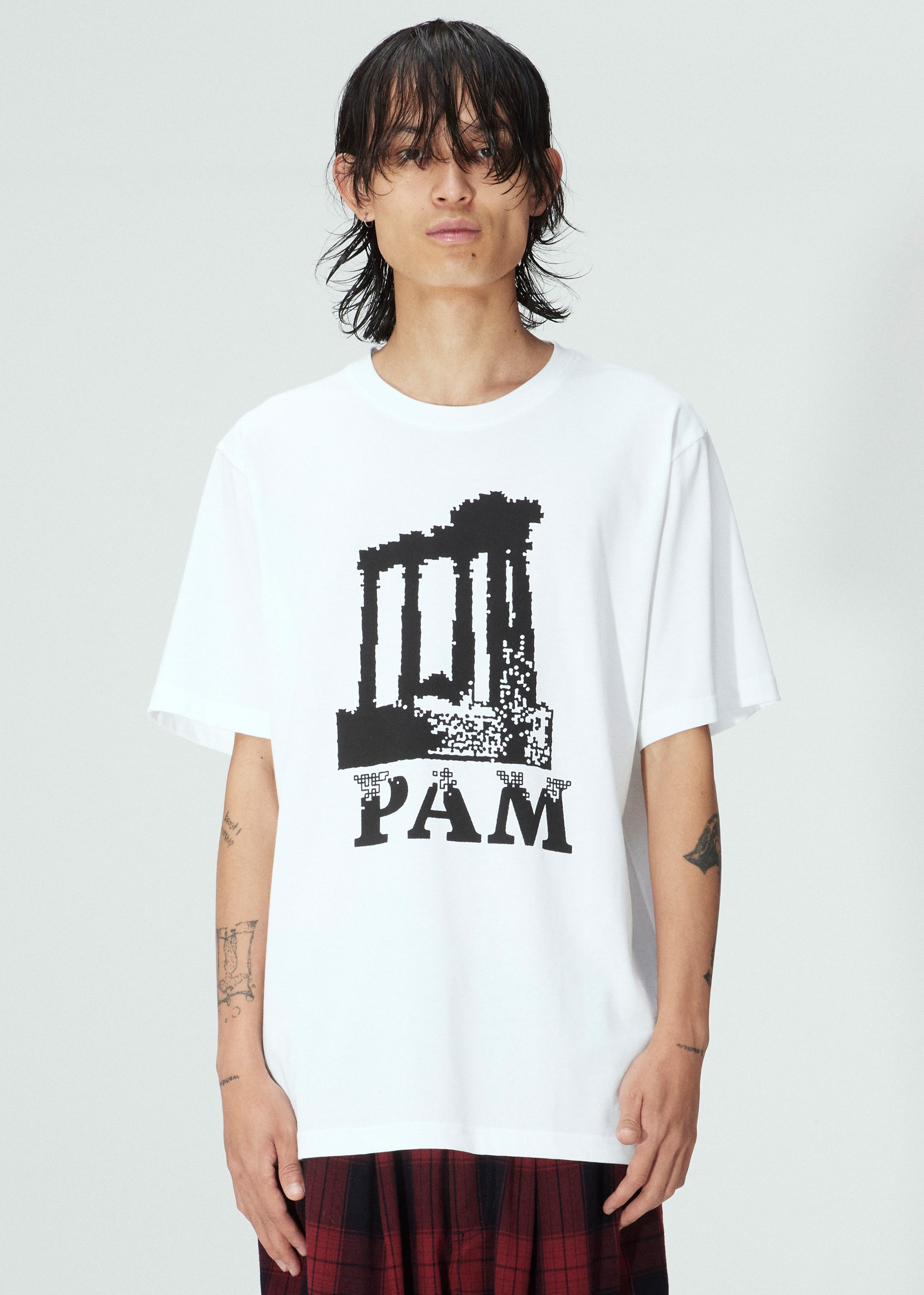 The PILLARS SS TEE WHITE  available online with global shipping, and in PAM Stores Melbourne and Sydney.