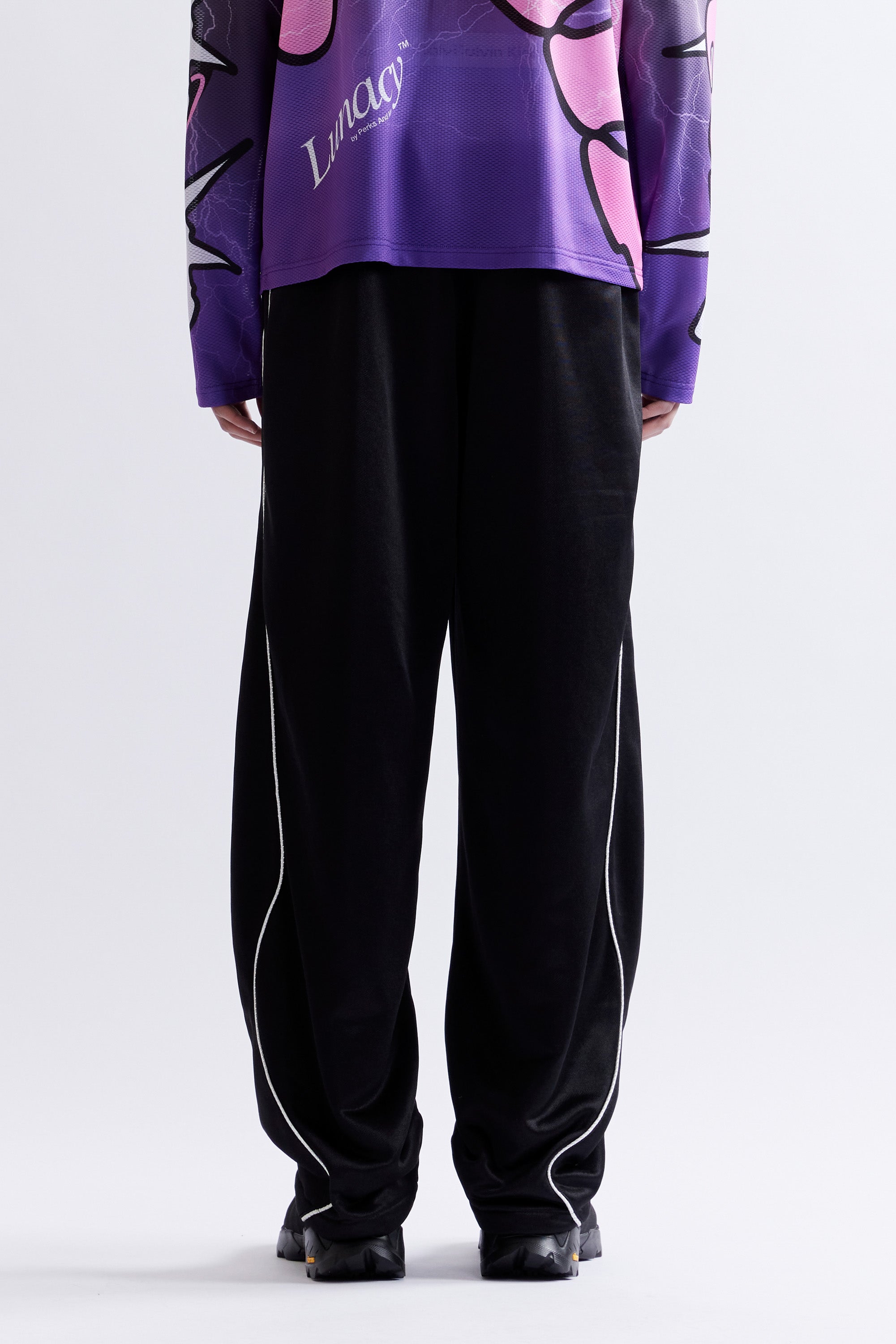The MIRAGE TRACK PANT - BLACK available online with global shipping, and in PAM Stores Melbourne and Sydney.