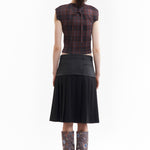 The SPIRAL JETTY PLEAT SKIRT available online with global shipping, and in PAM Stores Melbourne and Sydney.