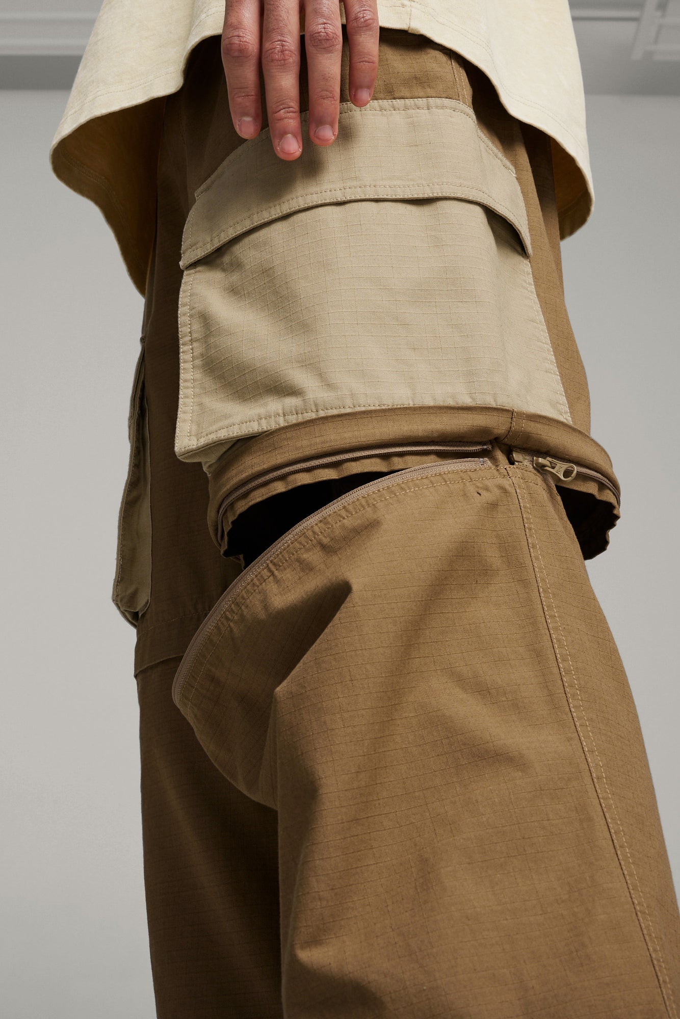 The PUMA X P.A.M. ZIP OFF PANTS  available online with global shipping, and in PAM Stores Melbourne and Sydney.