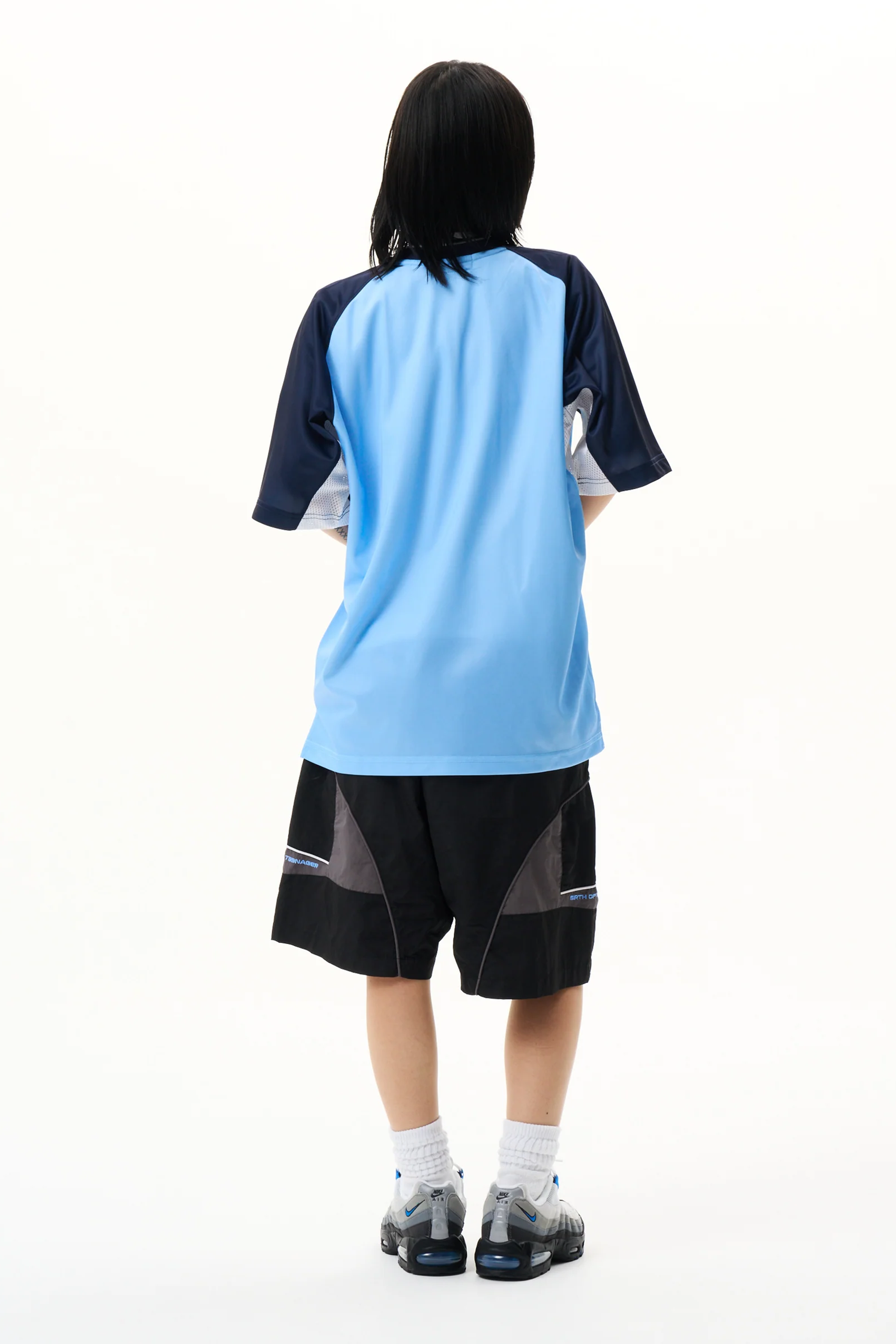 The Panelled Training Shirt Light Blue available online with global shipping, and in PAM Stores Melbourne and Sydney.