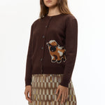 The BROWN BABY JACQUARD CALF CARDIGAN available online with global shipping, and in PAM Stores Melbourne and Sydney.