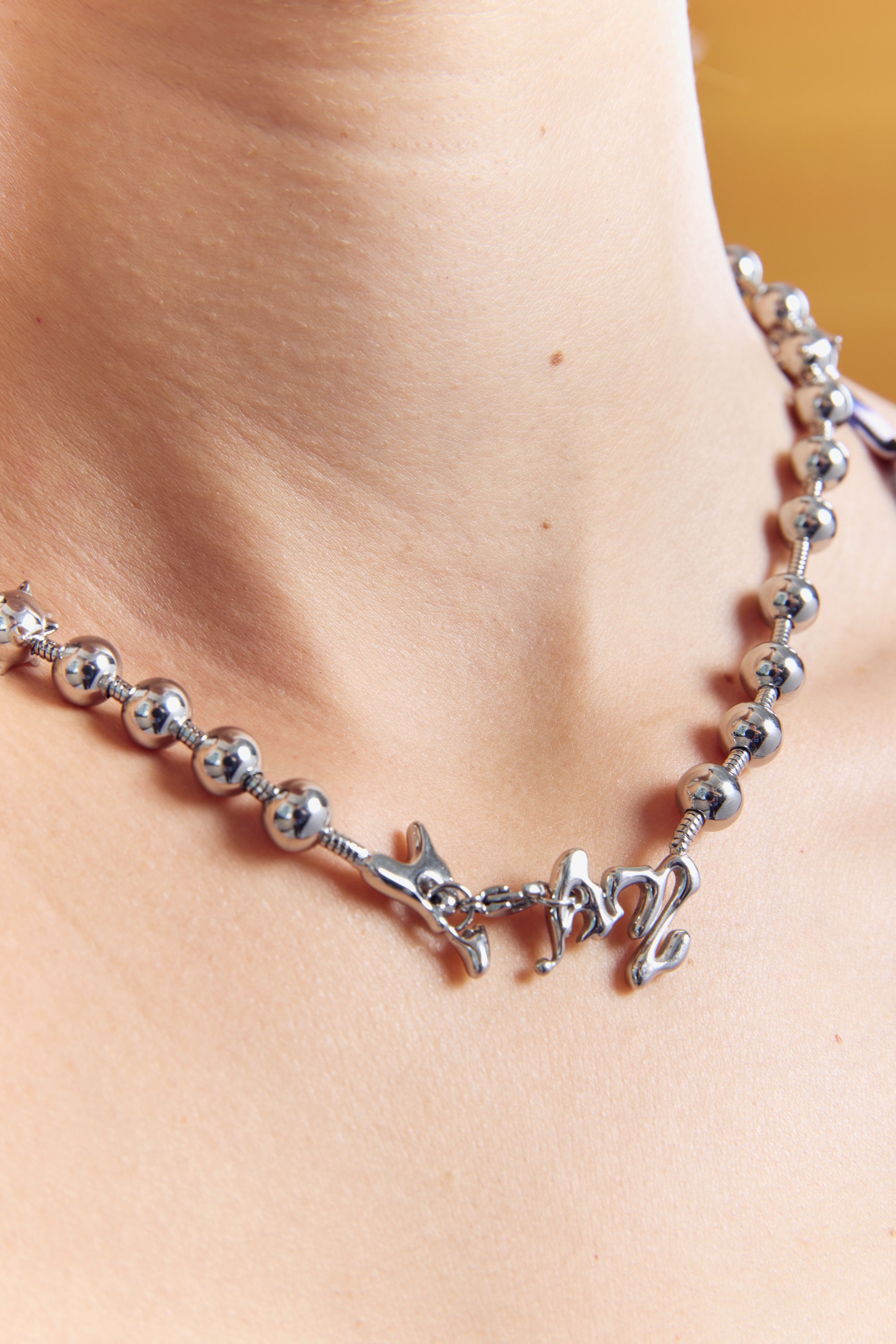 The CELESTIAL ORBS BALL AND CHAIN NECKLACE available online with global shipping, and in PAM Stores Melbourne and Sydney.