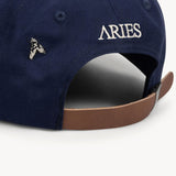 The ARIES - COLUMN A CAP NAVY  available online with global shipping, and in PAM Stores Melbourne and Sydney.