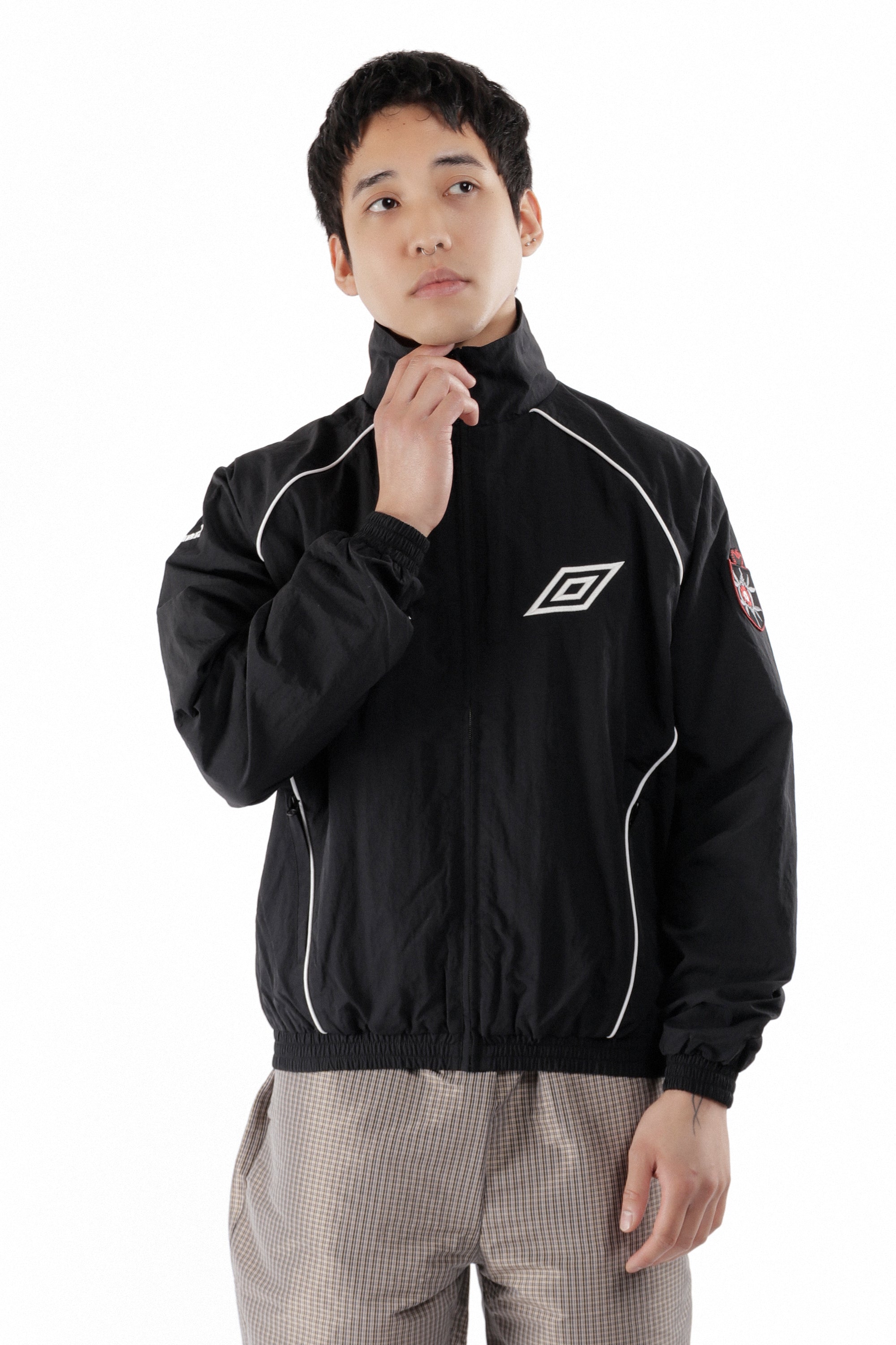The Eyes Tracksuit Jacket Black available online with global shipping, and in PAM Stores Melbourne and Sydney.