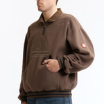 The FLEECE HALF ZIP UP KHAKI available online with global shipping, and in PAM Stores Melbourne and Sydney.