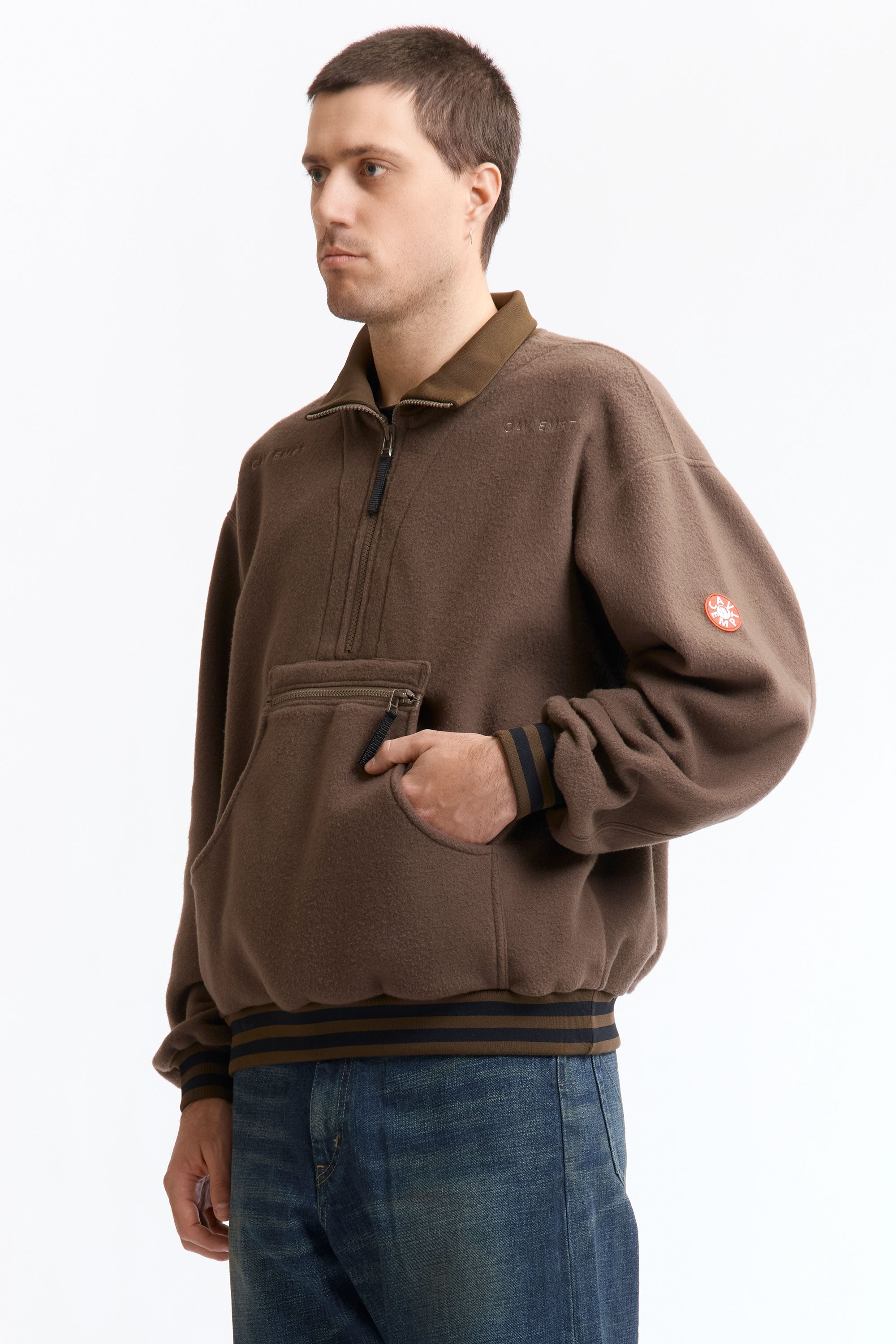 The FLEECE HALF ZIP UP KHAKI available online with global shipping, and in PAM Stores Melbourne and Sydney.
