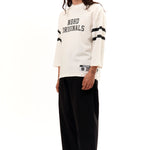 The FOOTBALL SHIRT LONGSLEEVE WHITE available online with global shipping, and in PAM Stores Melbourne and Sydney.