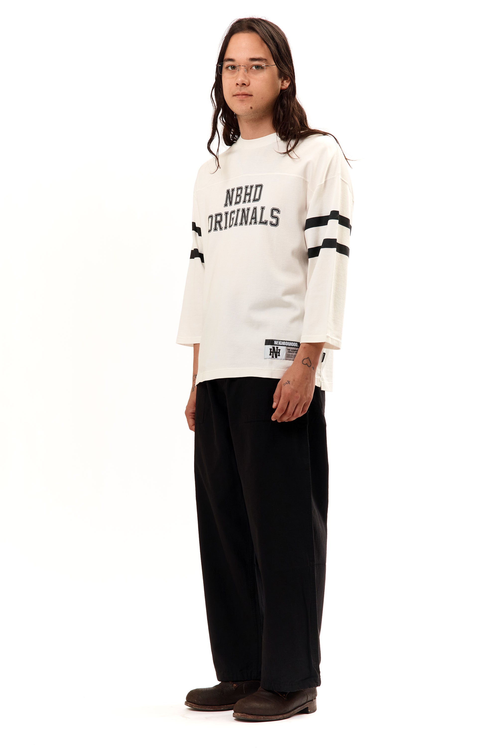 The FOOTBALL SHIRT LONGSLEEVE WHITE available online with global shipping, and in PAM Stores Melbourne and Sydney.