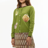 The VEGGIE PATCHWORK GREEN CARDIGAN available online with global shipping, and in PAM Stores Melbourne and Sydney.