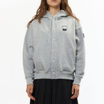 The VISOR BUTTON HOODIE HEATHER GREY available online with global shipping, and in PAM Stores Melbourne and Sydney.