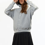 The VISOR BUTTON HOODIE HEATHER GREY available online with global shipping, and in PAM Stores Melbourne and Sydney.