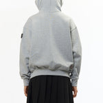 The VISOR BUTTON HOODIE HEATHER GREY available online with global shipping, and in PAM Stores Melbourne and Sydney.