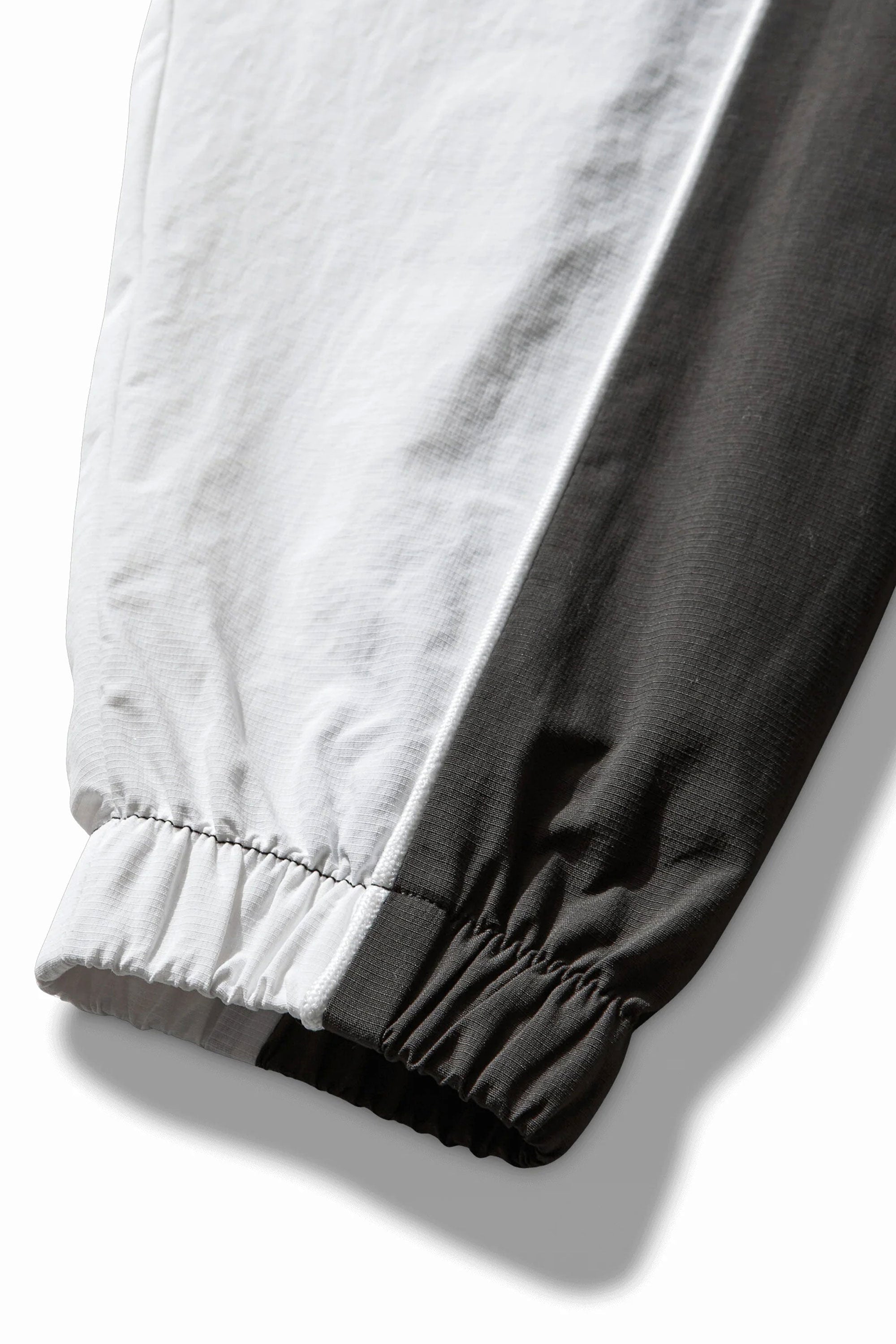 The Guarding Masked Tracksuit White Dark Olive available online with global shipping, and in PAM Stores Melbourne and Sydney.