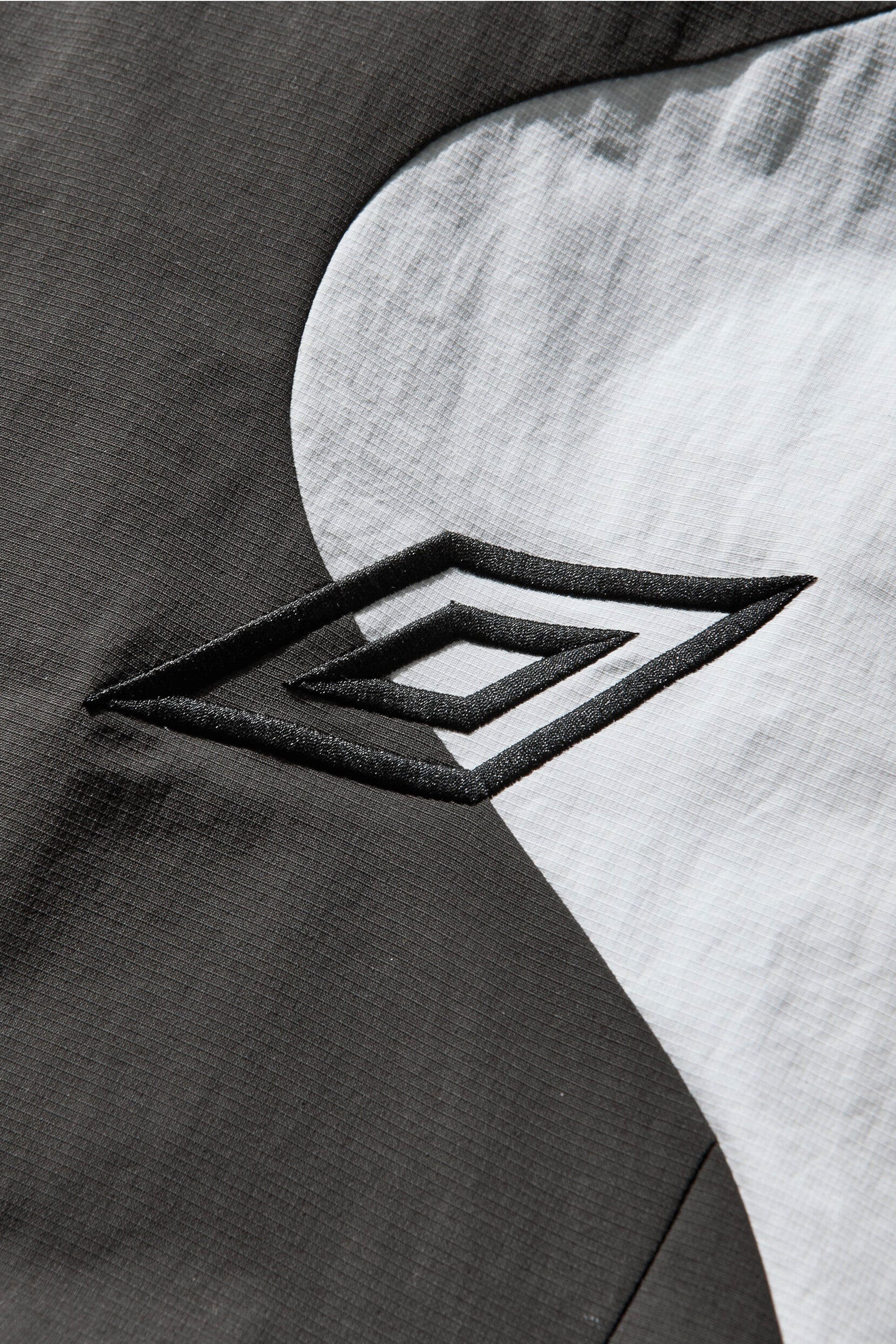 The Guarding Masked Tracksuit White Dark Olive available online with global shipping, and in PAM Stores Melbourne and Sydney.