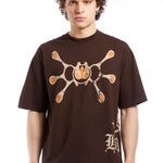 The H.P.F.C. Angel T-Shirt Brown  available online with global shipping, and in PAM Stores Melbourne and Sydney.