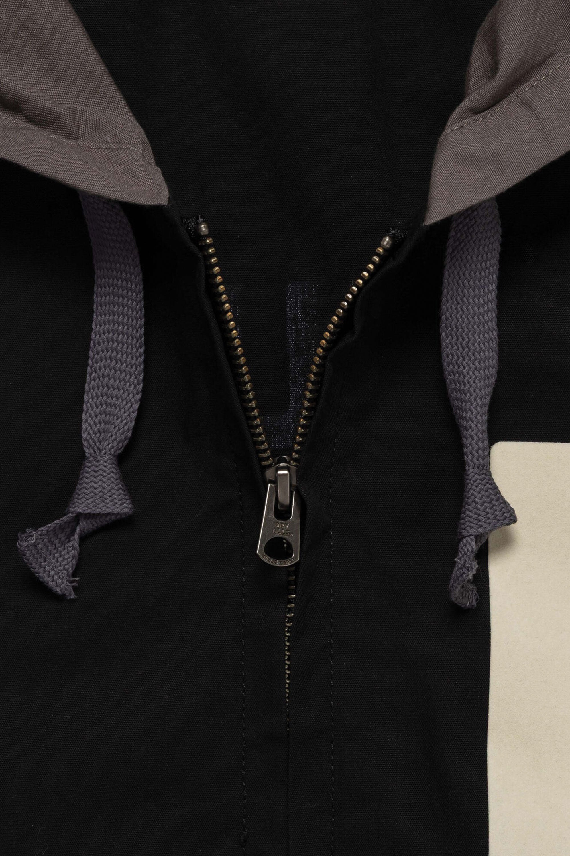 The HOODED JACKET BLACK available online with global shipping, and in PAM Stores Melbourne and Sydney.
