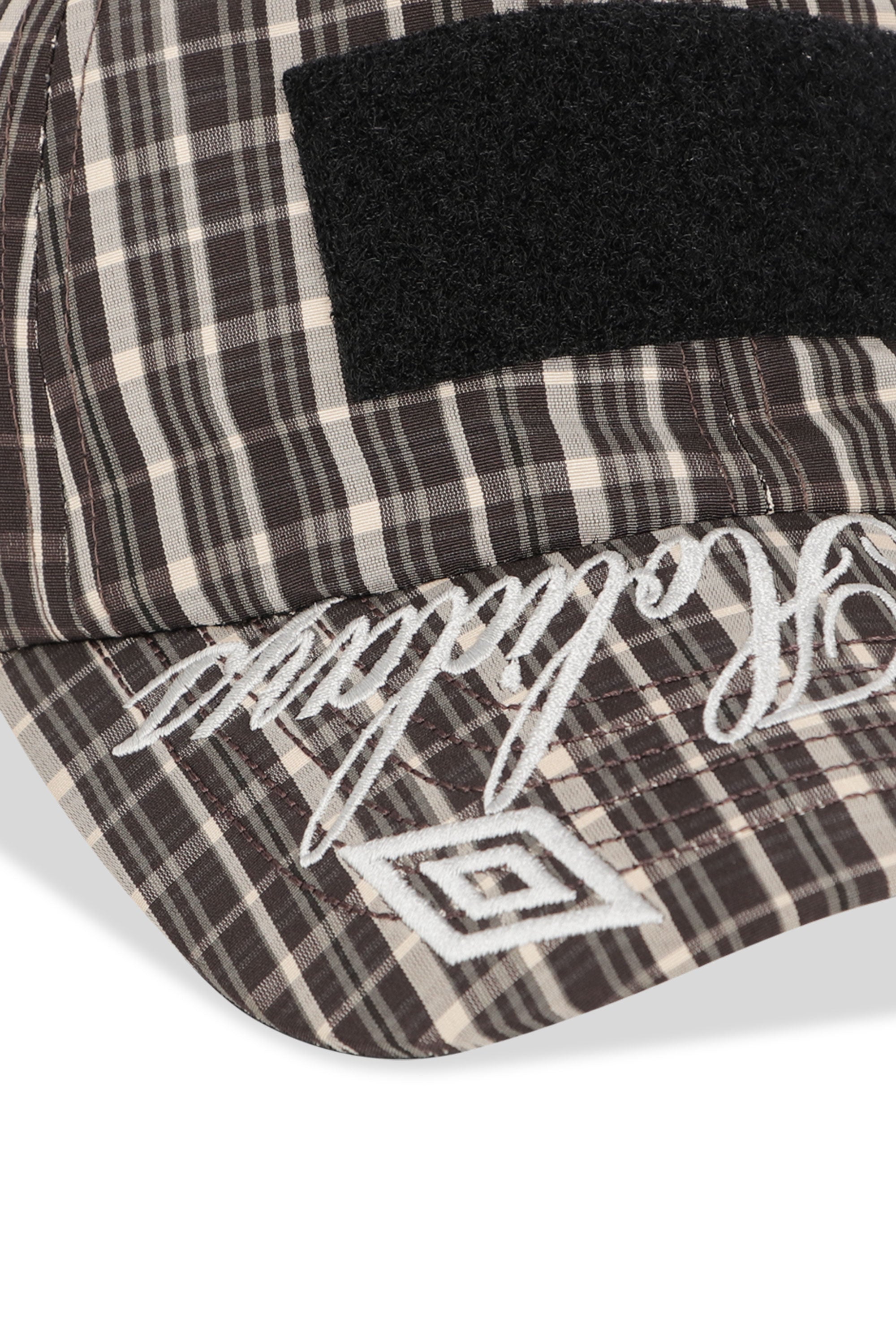 The SS26 Check Hazard Cap Beige Dark Brown available online with global shipping, and in PAM Stores Melbourne and Sydney.