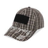 The SS26 Check Hazard Cap Beige Dark Brown available online with global shipping, and in PAM Stores Melbourne and Sydney.