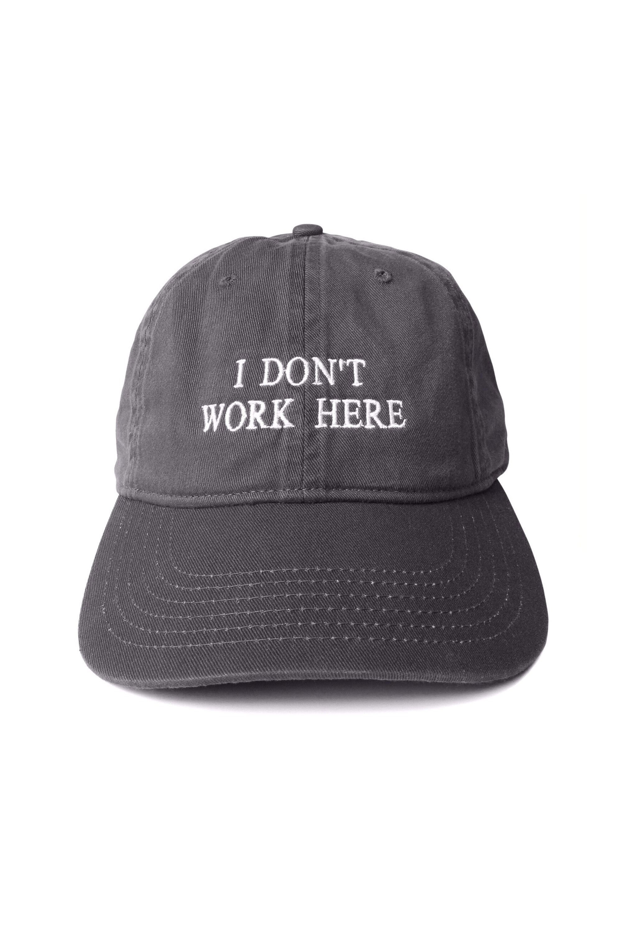 The IDEA - "SORRY I DON'T WORK HERE" CAP CHARCOAL available online with global shipping, and in PAM Stores Melbourne and Sydney.