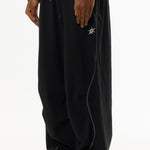 The ILLUSIONISTS PANTS OVERDYE BLACK available online with global shipping, and in PAM Stores Melbourne and Sydney.